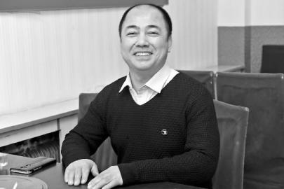 說起資助的那些孩子取得了好成績,張金彪笑得很開心新文化記者闞旋攝